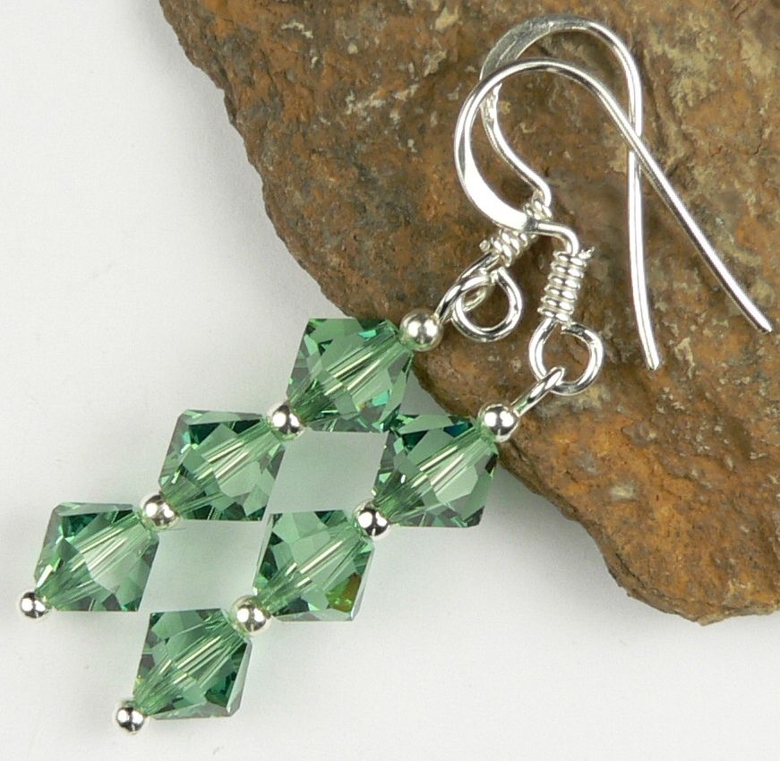 Earrings made with green Erinite Swarovski Elements