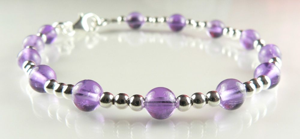 3mm sterling silver bead & 6mm (+/-) Amethyst semi-precious stone bead bracelet with lobster clasp, in a gift box.