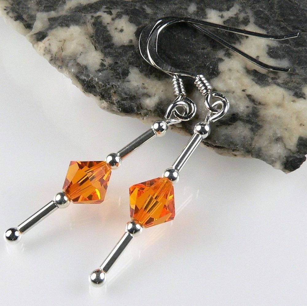 earrings made with orange Sun Swarovski Elements