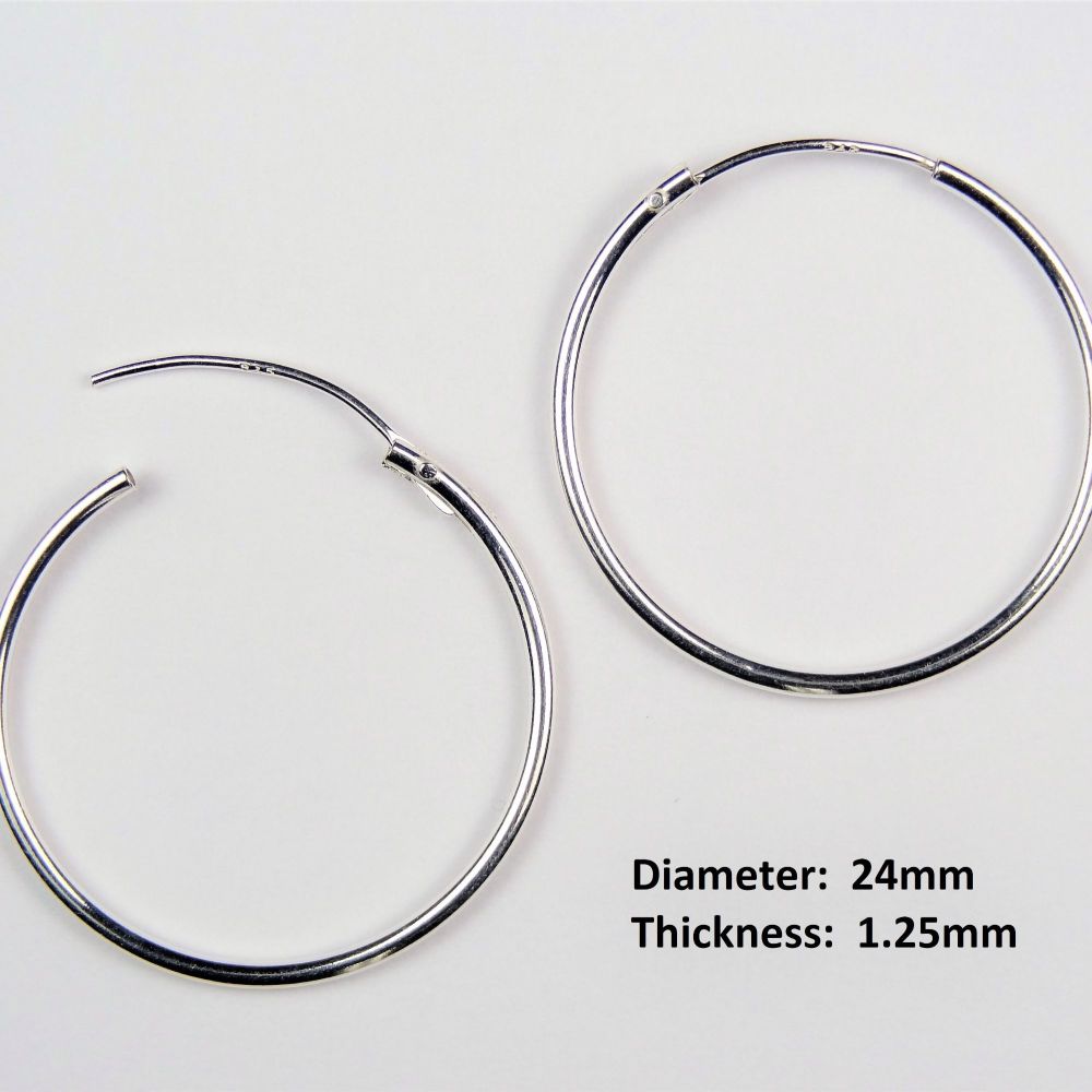 Pair of sterling silver earrings with 12mm Tree of Life charms, on 24mm hoops, in a gift box