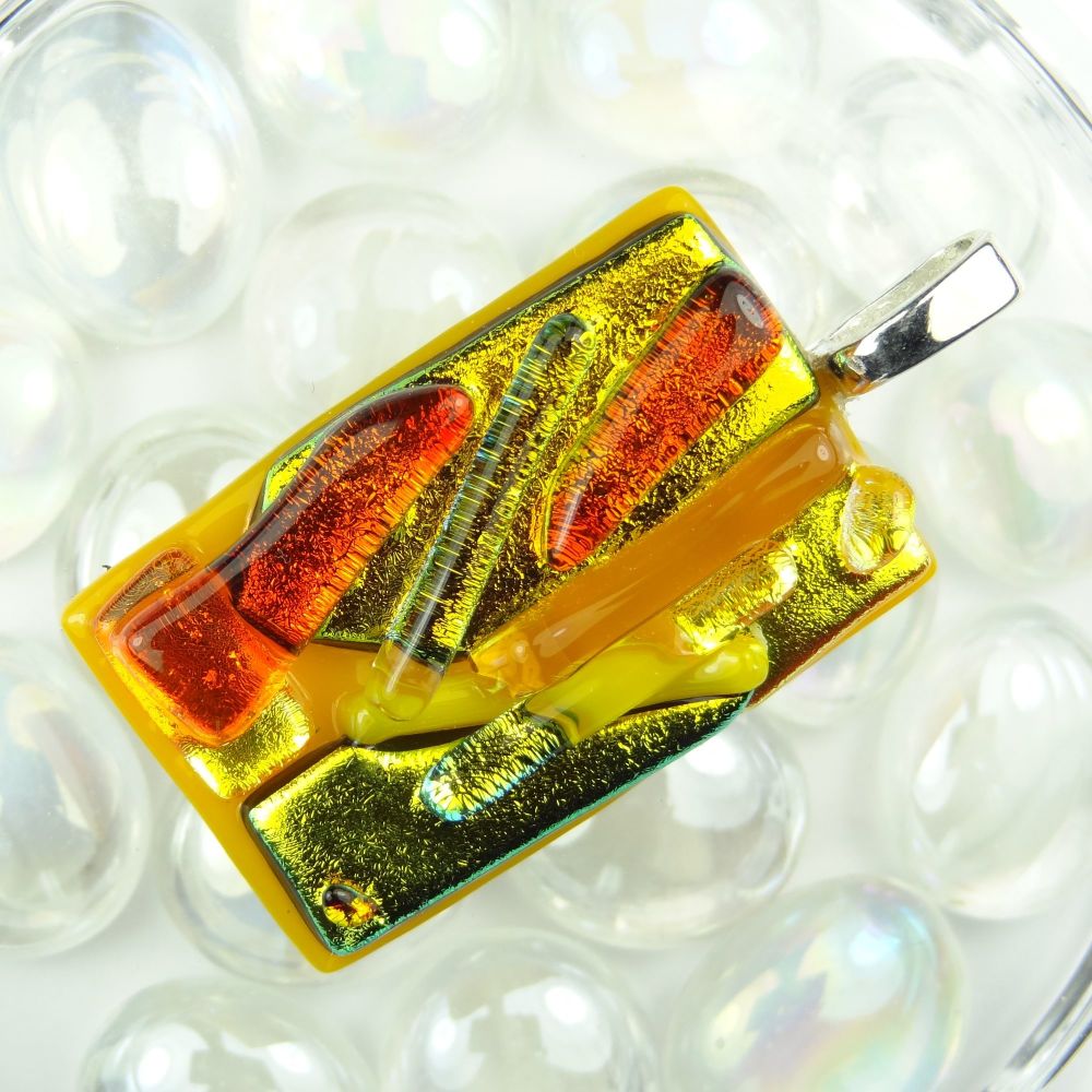 orange/yellow/gold textured Dichroic glass pendant, with leather cord