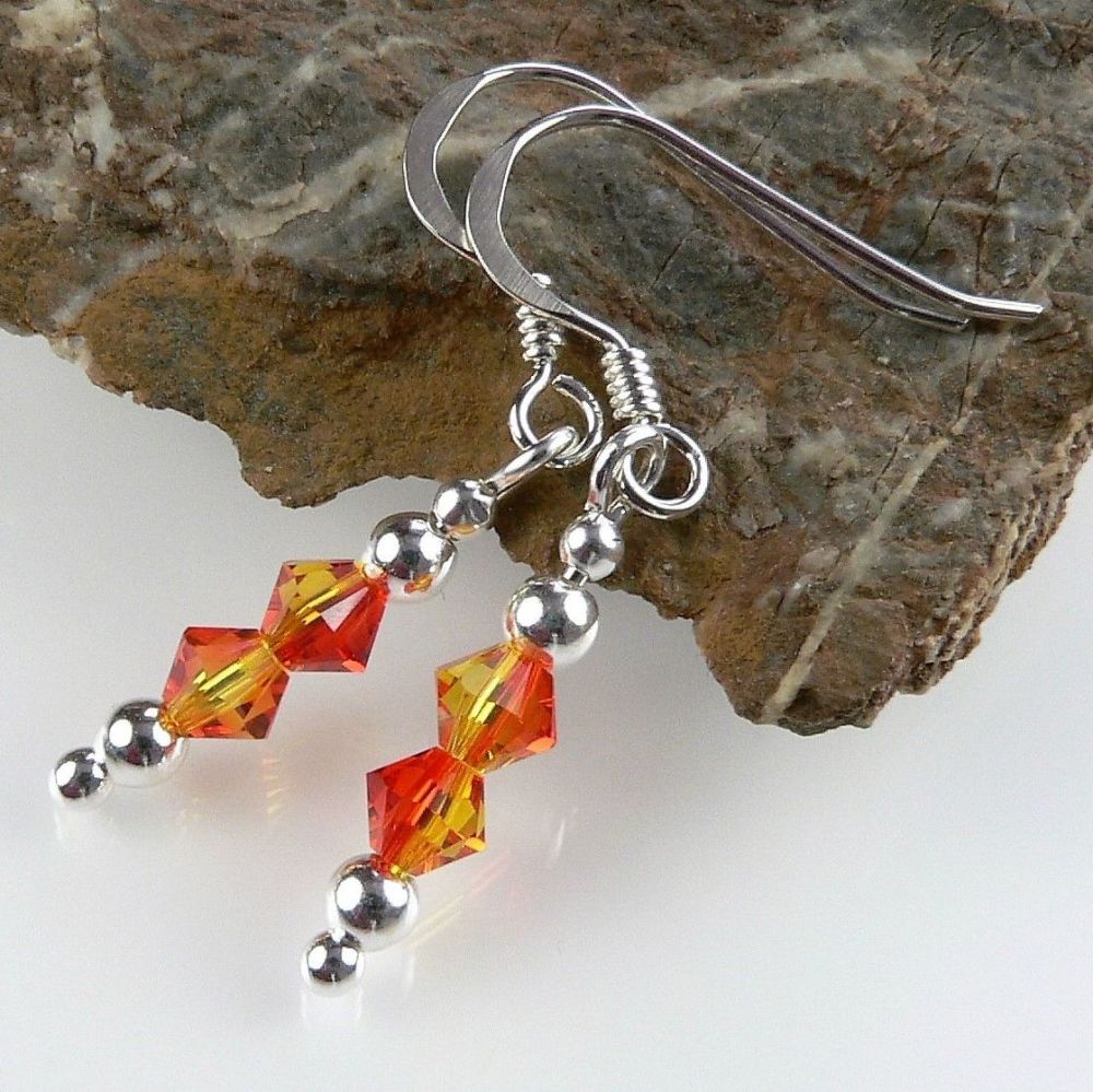 Earrings made with orange Fireopal Swarovski Elements