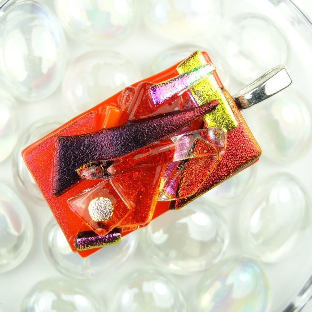 4.6cm multi-coloured textured dichroic glass pendant, with leather cord