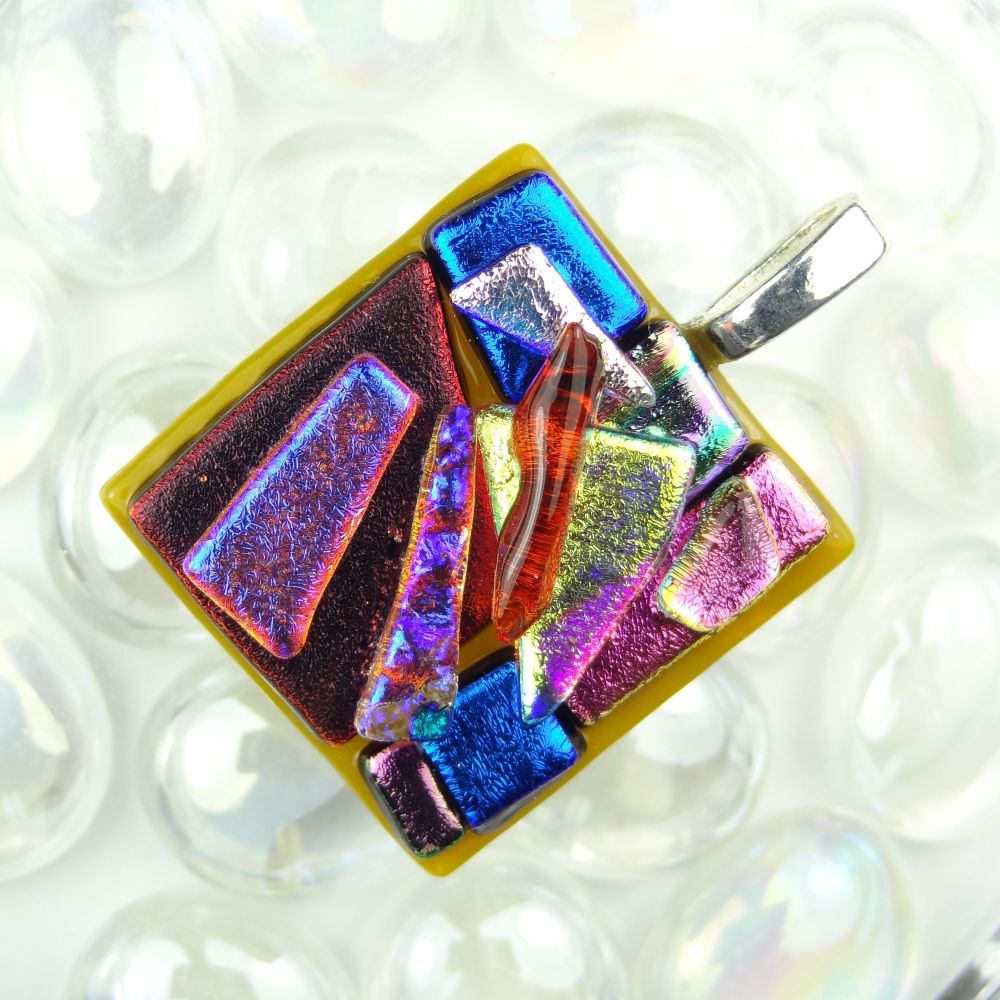 3.8cm multi-coloured textured dichroic glass pendant, with leather cord