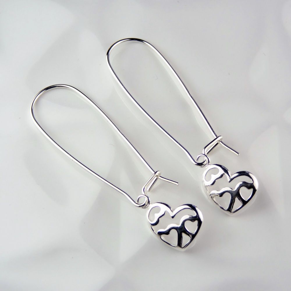 Sterling silver earrings with 12mm multi hearts on their side, on 35mm kidney wires, in a gift box