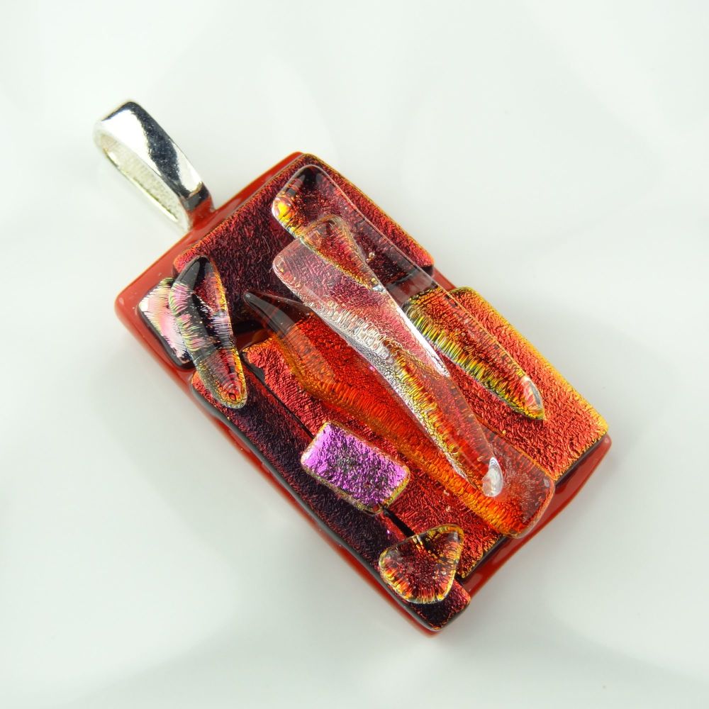 4.4cm textured, shades of red, genuine dichroic glass pendant, with cord