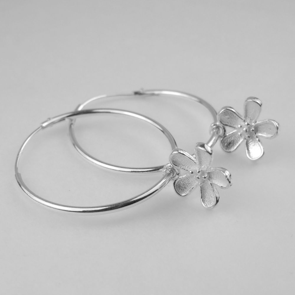Sterling silver 24mm hoop earrings with 10mm sterling silver flowers, in a gift box