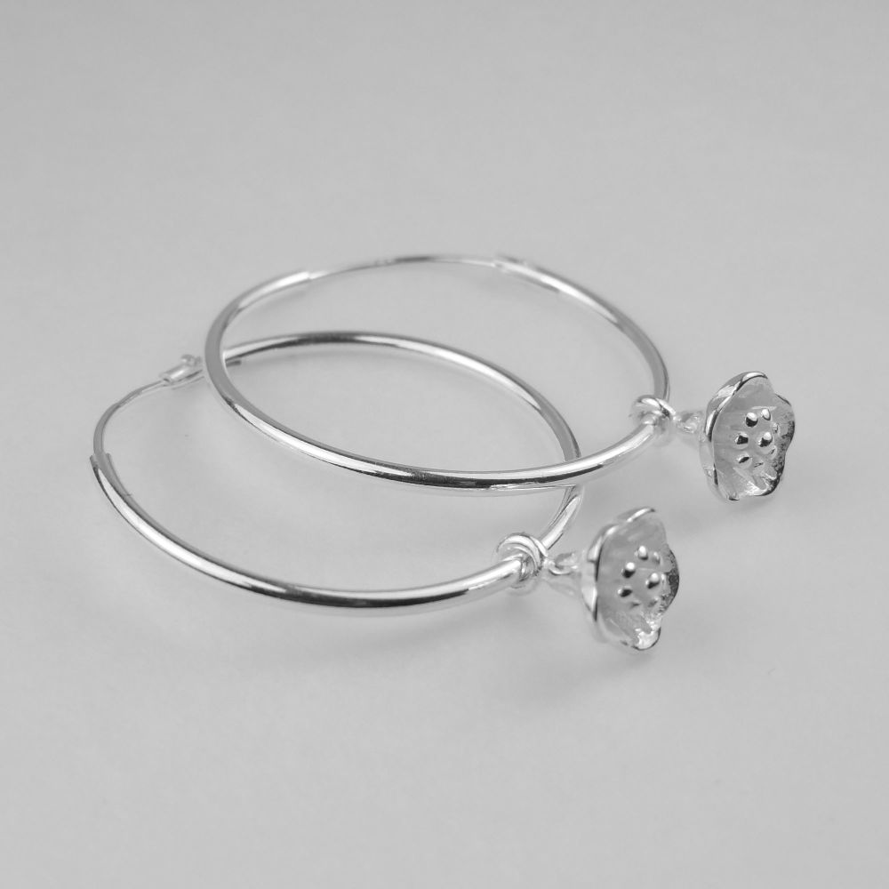 Sterling silver 24mm hoop earrings with 6mm sterling silver hanging flowers, in a gift box