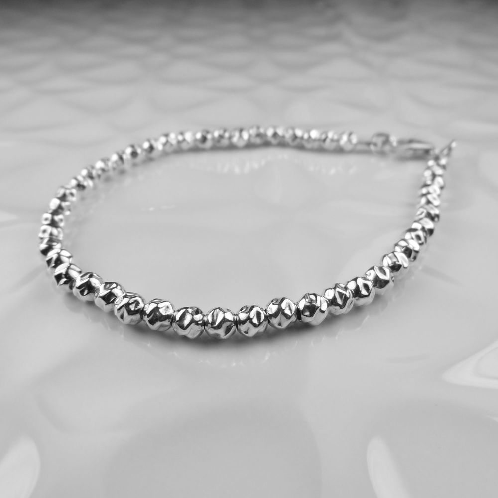 Sterling silver hammered bead bracelet, with lobster clasp