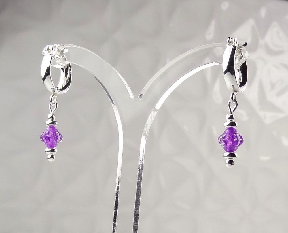 Purple Czech glass flowers hanging from sterling silver 12mm huggie-hoops