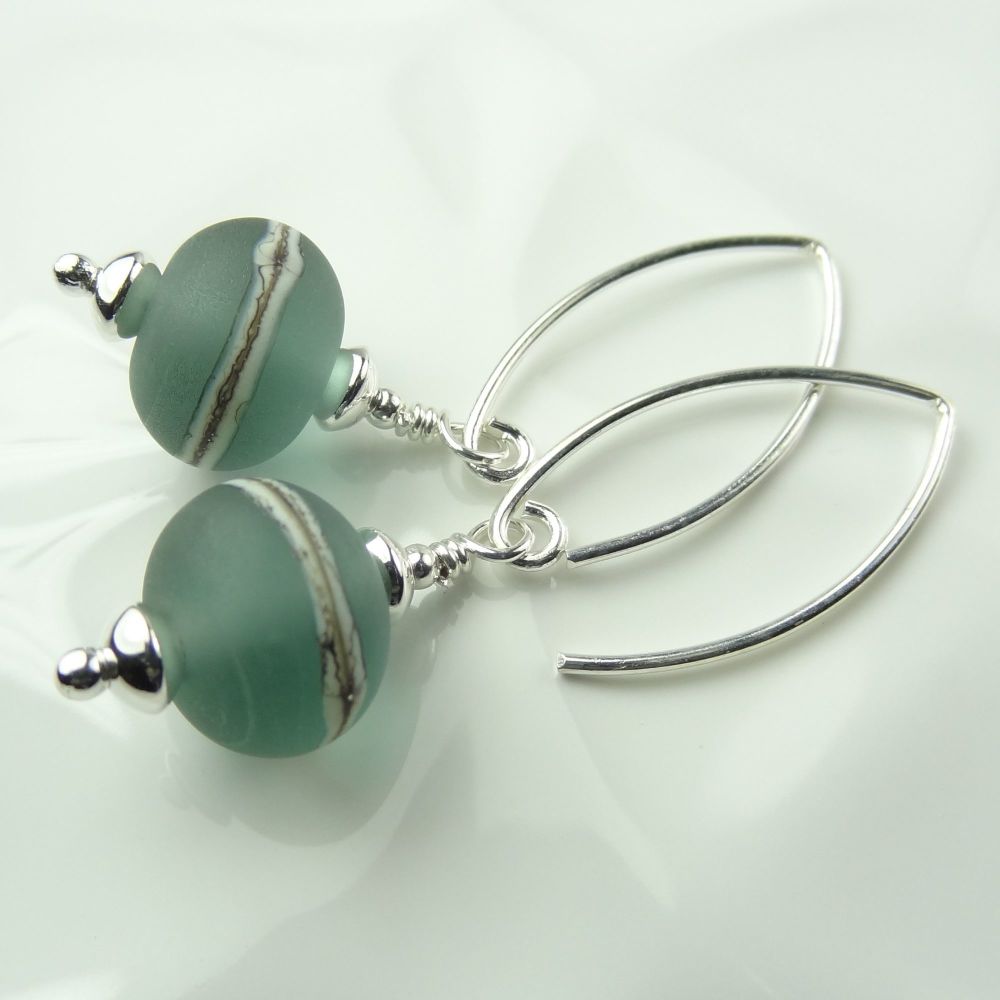 Satin finish green with silvered ivory stringer handcrafted glass earrings