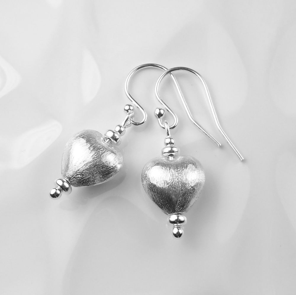 Brushed finish 10mm puffed heart sterling silver earrings, on french wires, in a gift box with polishing cloth