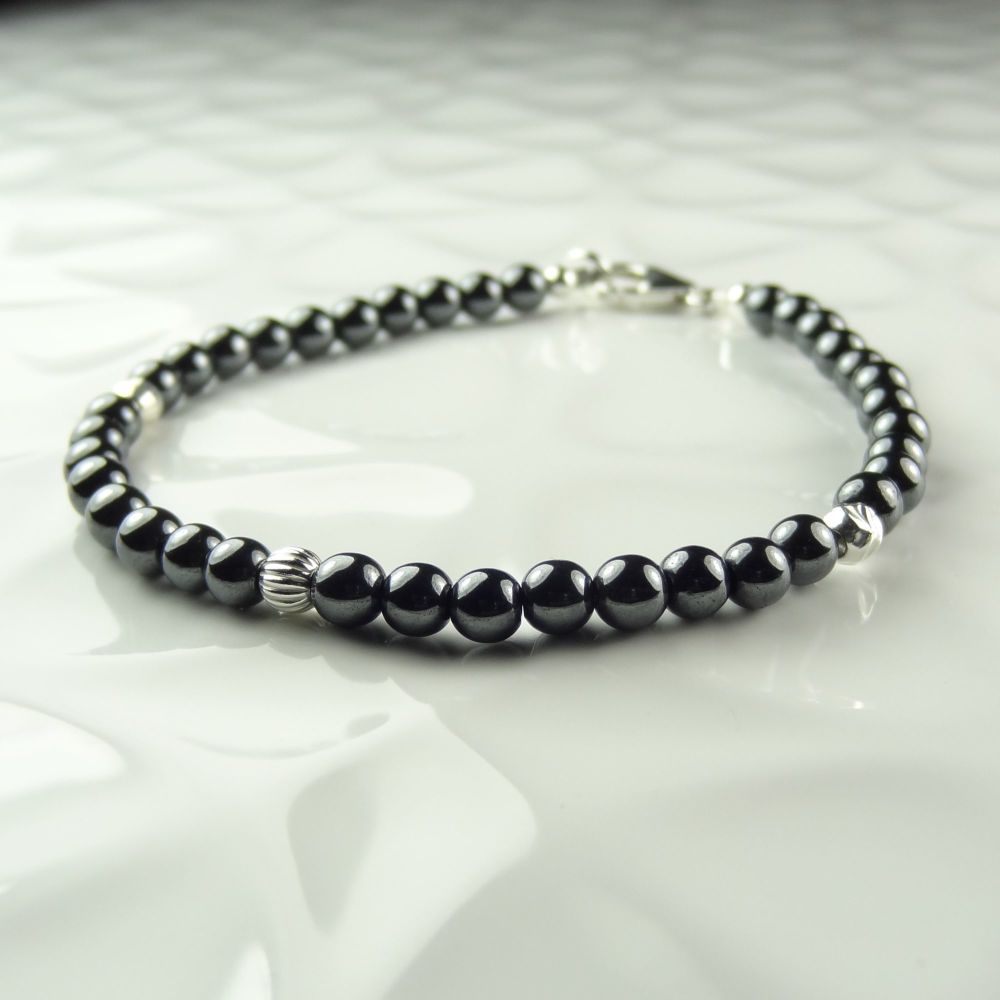 4mm (+/-) grey Hematite semi-precious stone & sterling silver fluted, hammered & faceted bead bracelet with lobster clasp, in a gift box