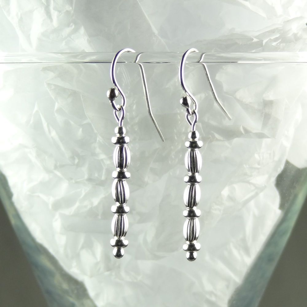 Sterling silver drop/dangle earrings with silver tyres and fluted ovals on French wires, in a gift box