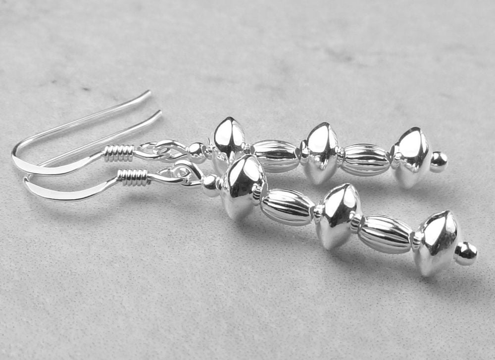 Sterling silver earrings on either fish or kidney wires in a gift box - rondelles and fluted ovals, Town Talk Silver Polishing Cloth (#30585)