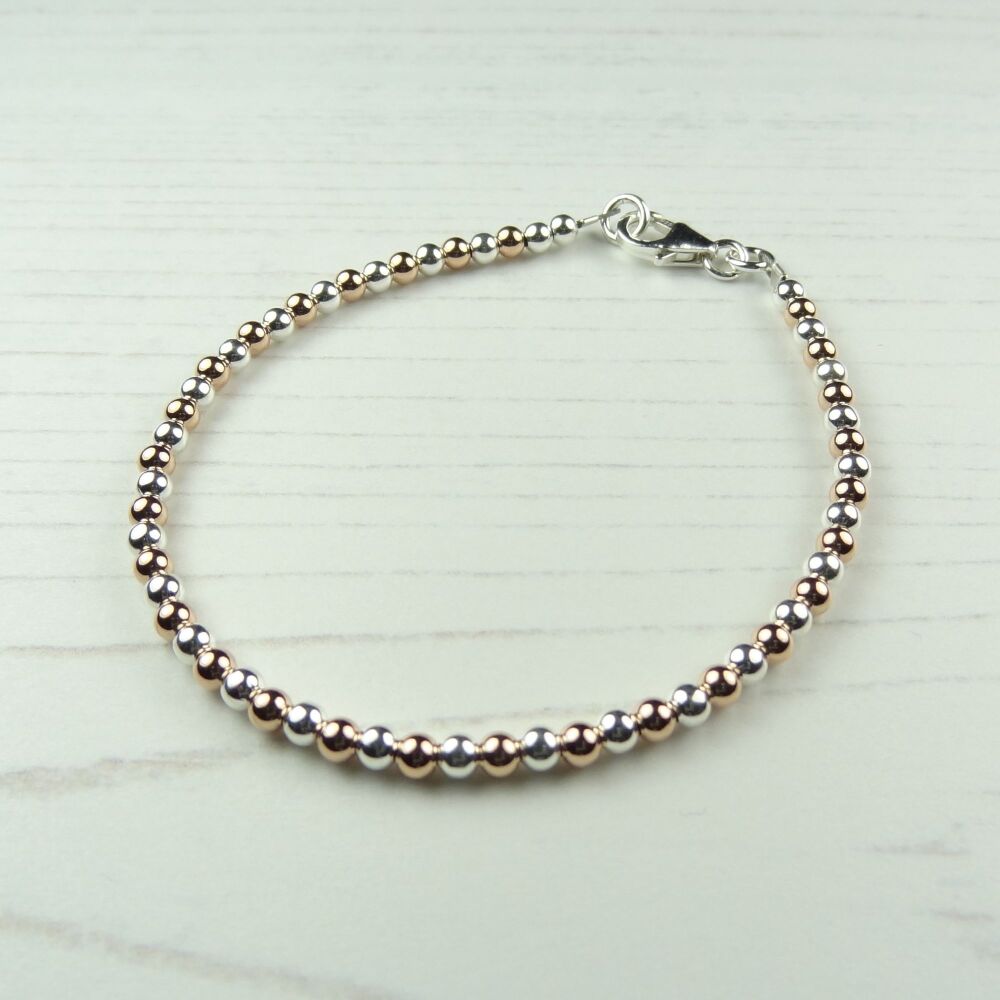 Sterling silver & 14K rose-gold filled bead stacking bracelet with lobster clasp (#3 ~ round)