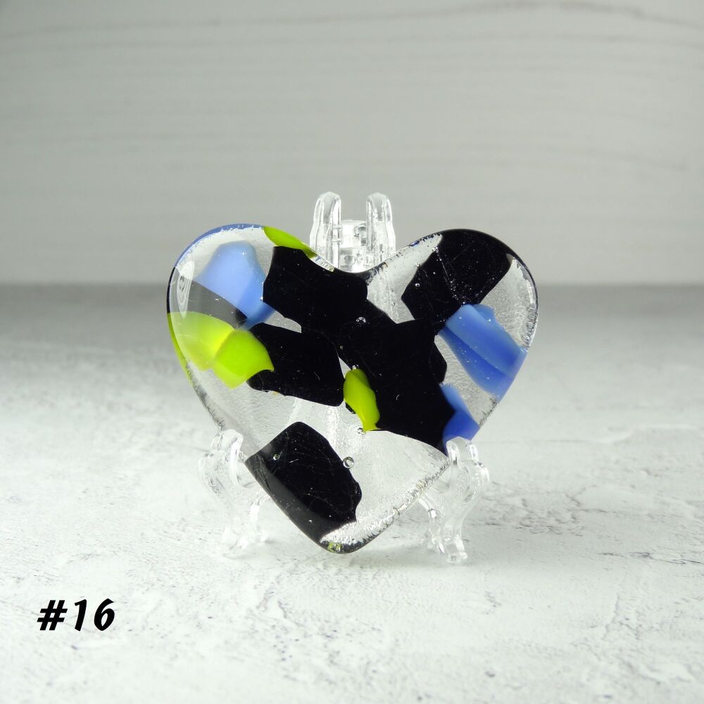 Handcrafted multi-coloured black blue green fused glass heart with a stand 