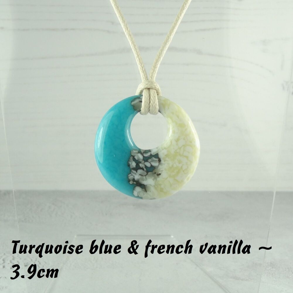 Handcrafted turquoise blue & french vanilla fused glass off-set round pendant on a waxed cotton cord with lobster clasp (#38)