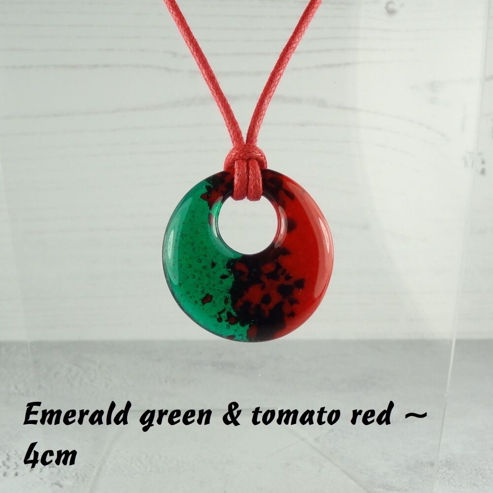 Handcrafted emerald green & tomato red fused glass off-set round pendant on a waxed cotton cord with lobster clasp (#34)