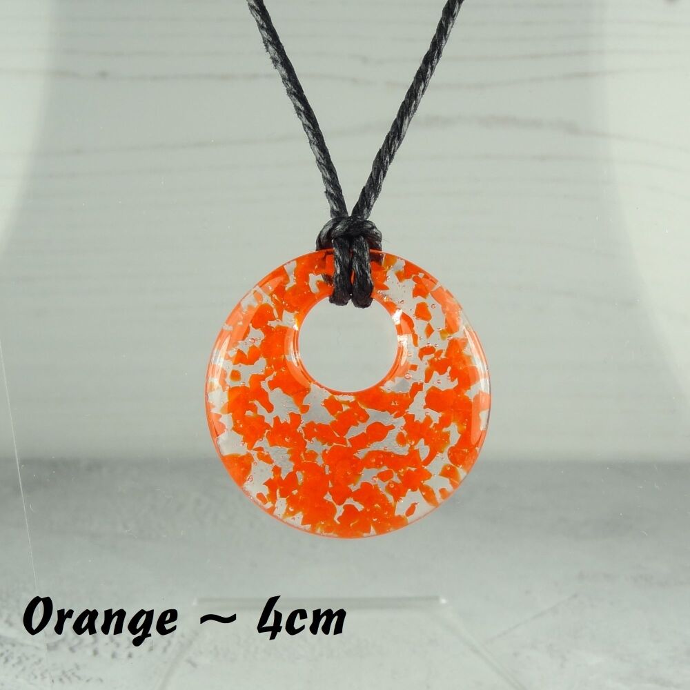 Handcrafted orange fused glass off-set round pendant on a waxed cotton cord with lobster clasp (#24)