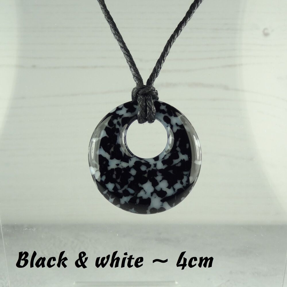 Handcrafted black & white fused glass off-set round pendant on a waxed cotton cord with lobster clasp (#28)