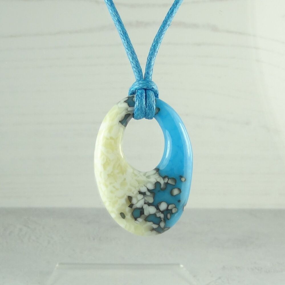 Handcrafted light cyan & french vanilla fused glass off-set oval pendant on a waxed cotton cord with lobster clasp (#32)