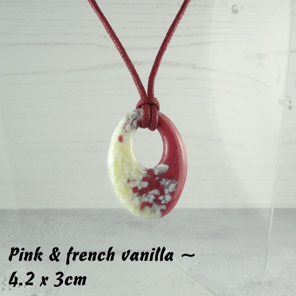 Handcrafted pink & french vanilla fused glass off-set oval pendant on a waxed cotton cord with lobster clasp (#35)