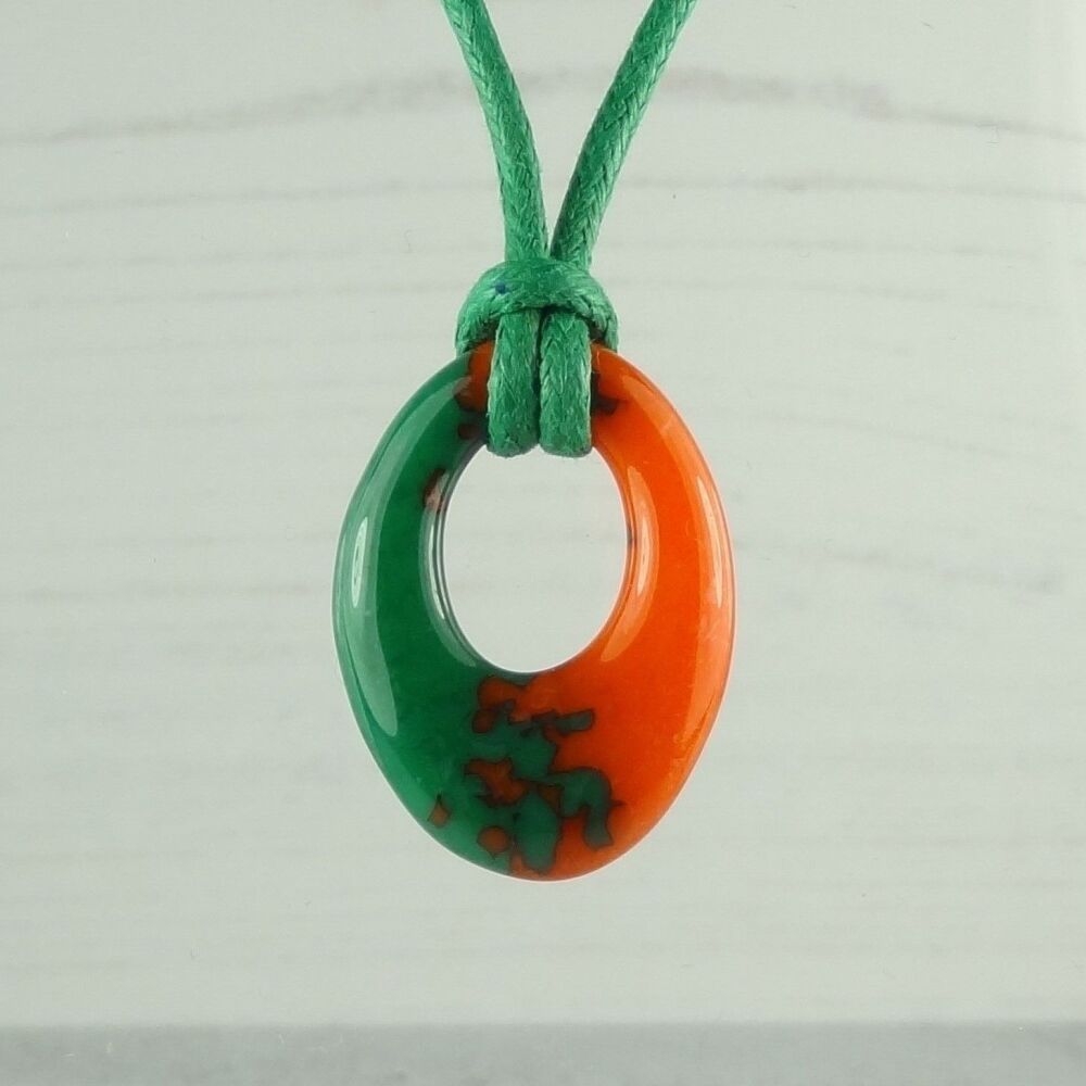 Handcrafted jade green & tangerine fused glass off-set oval pendant on a waxed cotton cord with lobster clasp (#41)