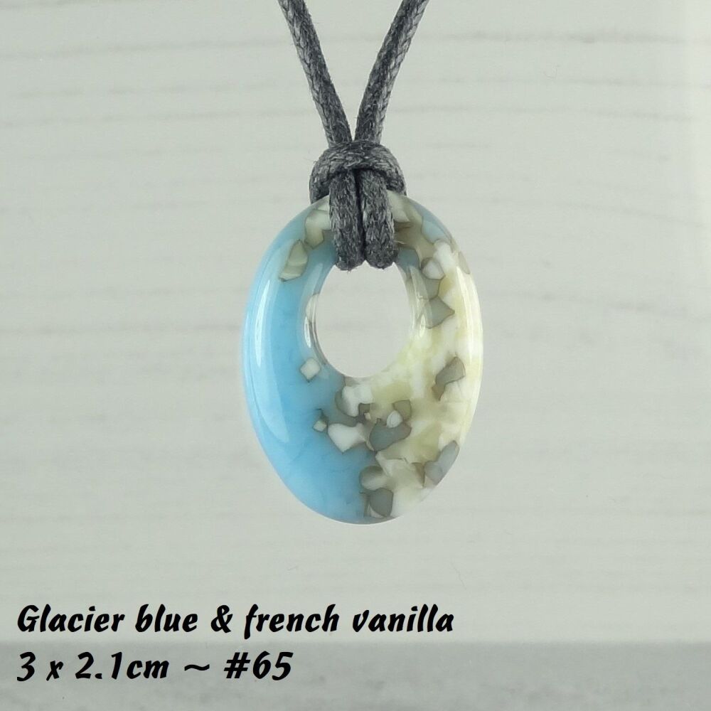 Handcrafted glacier blue & french vanilla fused glass off-set oval pendant on a waxed cotton cord with lobster clasp (#65)