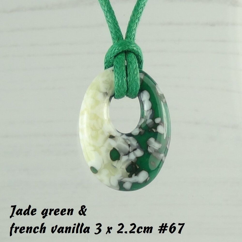 Handcrafted jade green & french vanilla fused glass off-set oval pendant on a waxed cotton cord with lobster clasp (#67)