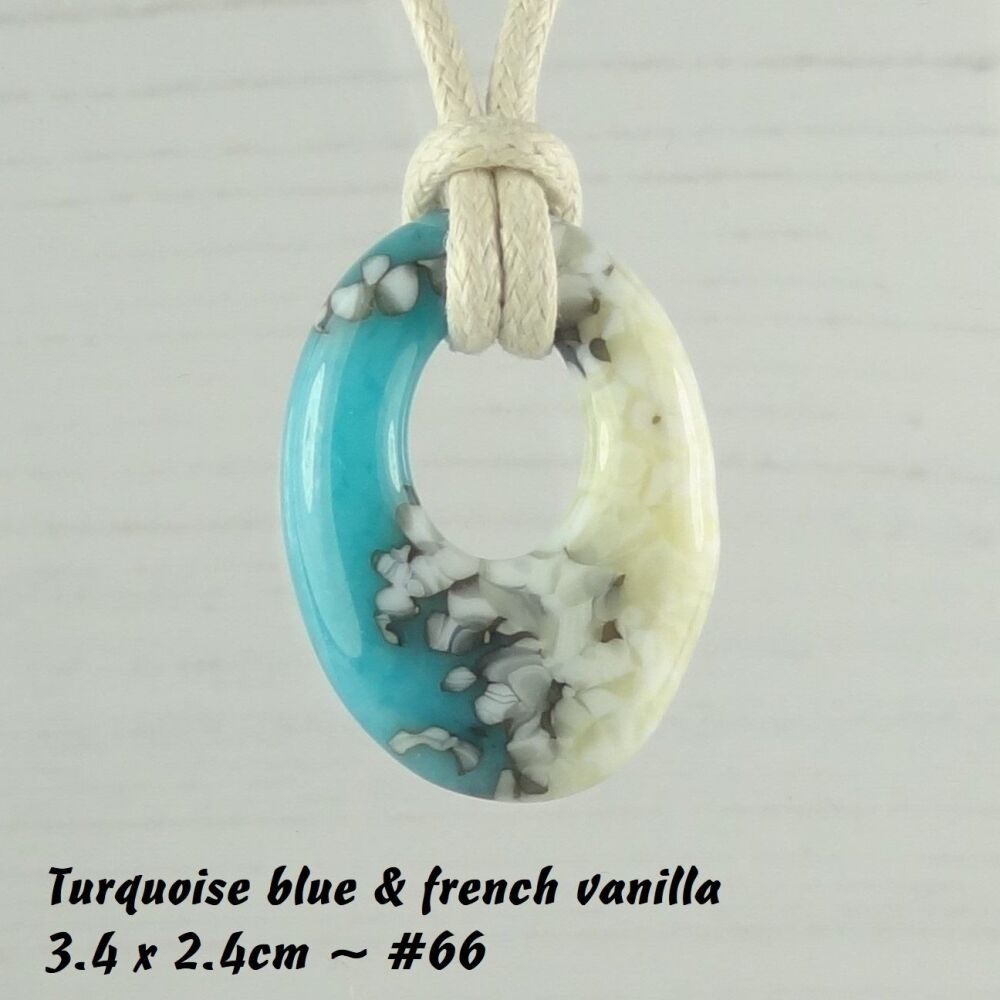 Handcrafted turquoise blue & french vanilla fused glass off-set oval pendant on a waxed cotton cord with lobster clasp (#66)