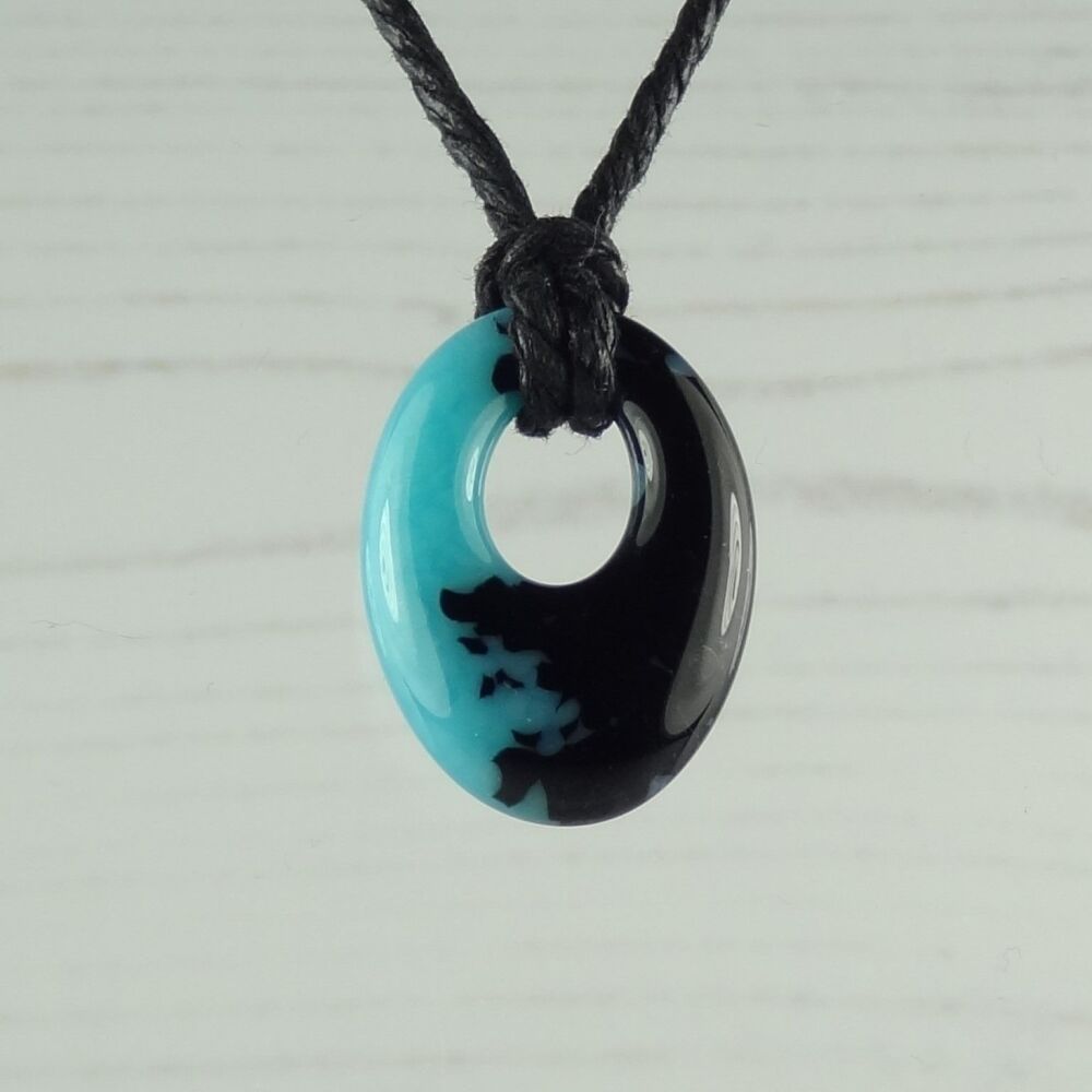 Handcrafted turquoise blue & black-blue fused glass off-set oval pendant on a waxed cotton cord with lobster clasp (#107)