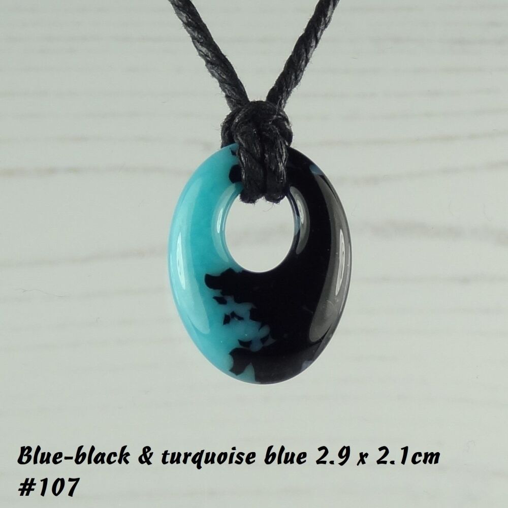 Handcrafted turquoise blue & black-blue fused glass off-set oval pendant on a waxed cotton cord with lobster clasp (#107)