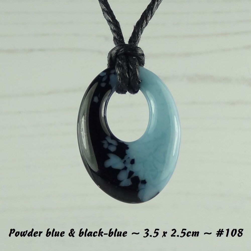 Handcrafted powder blue & black-blue fused glass off-set oval pendant on a waxed cotton cord with lobster clasp (#108)