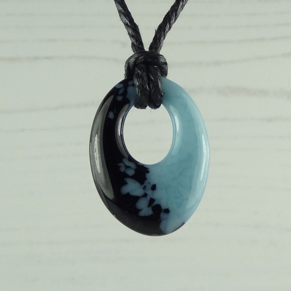 Handcrafted powder blue & black-blue fused glass off-set oval pendant on a waxed cotton cord with lobster clasp (#108)