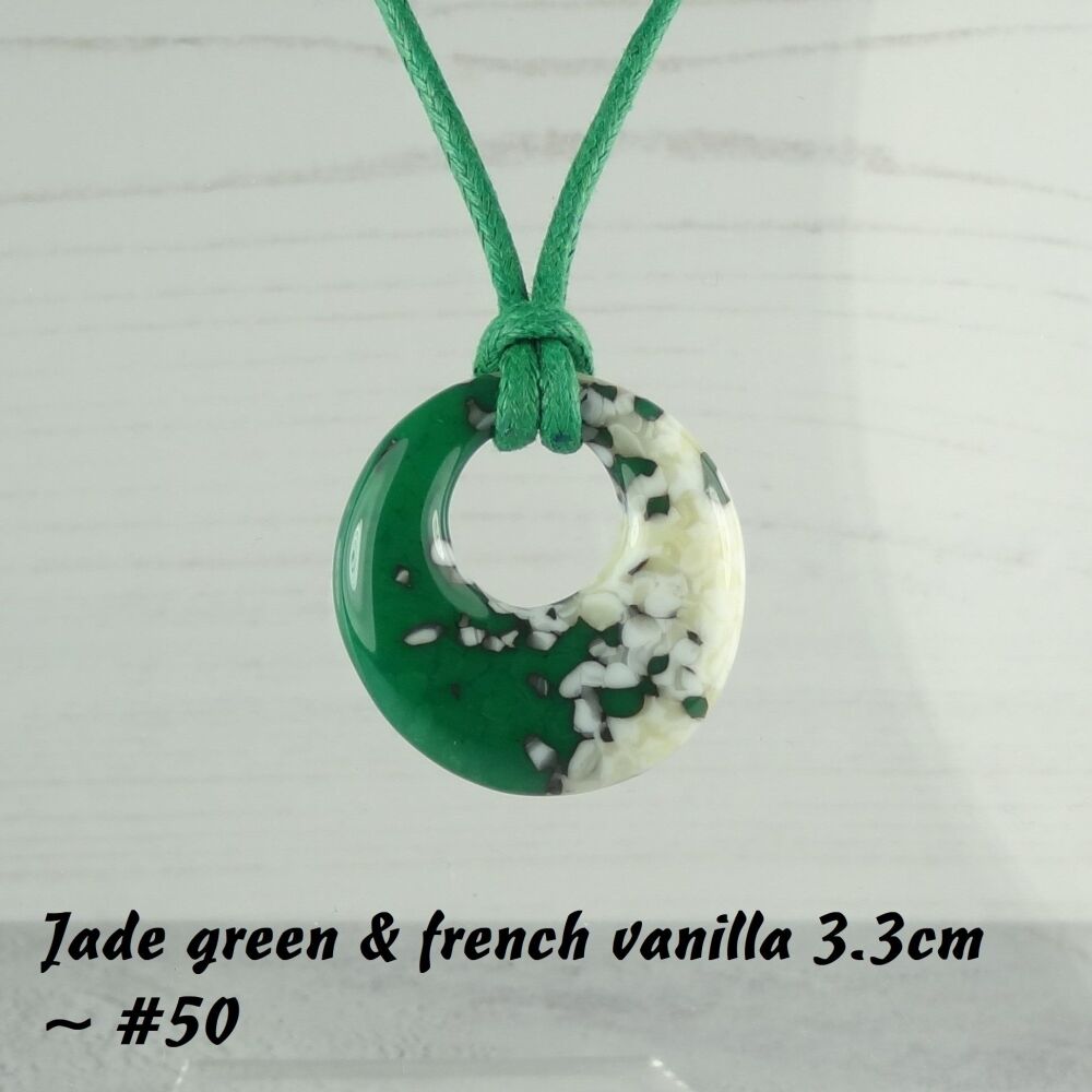 Handcrafted jade green & french vanilla fused glass off-set round pendant on a waxed cotton cord with lobster clasp (#50)