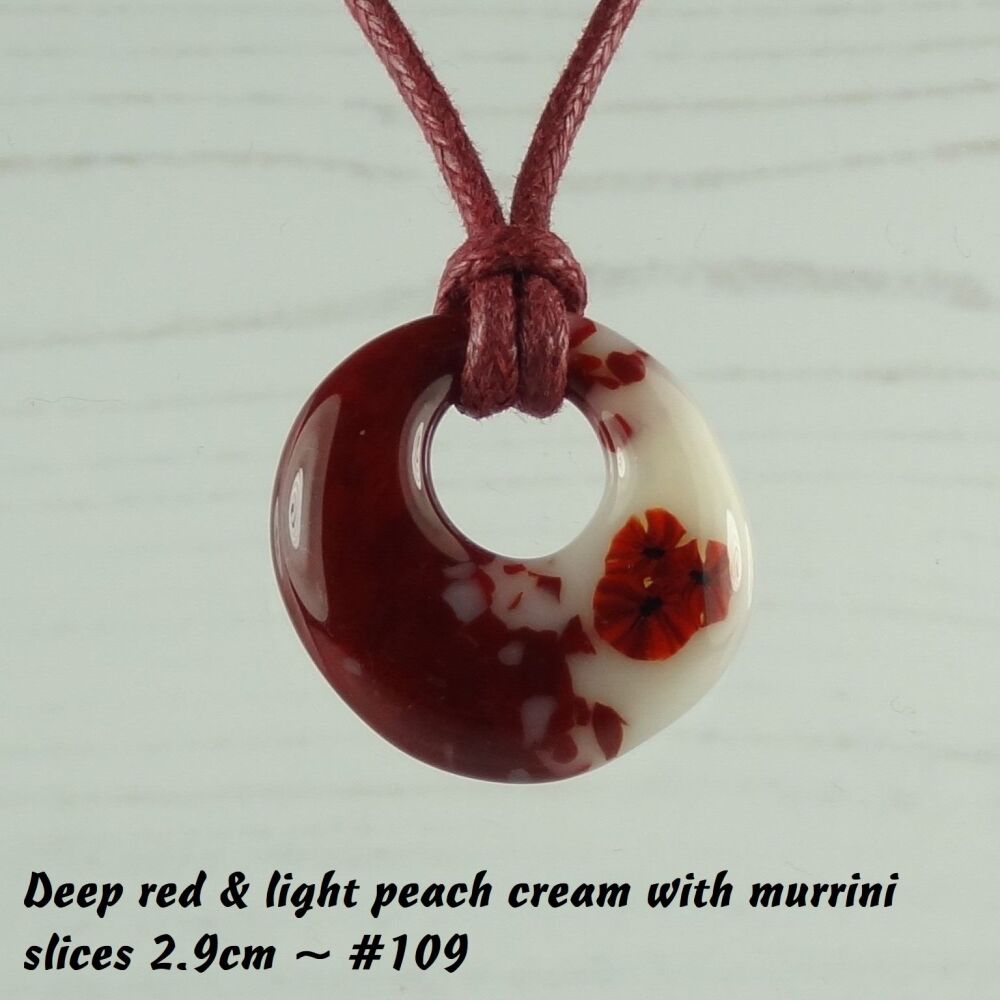 Handcrafted deep red & light peach cream with murrini slices fused glass off-set round pendant on a waxed cotton cord with lobster clasp (#109)