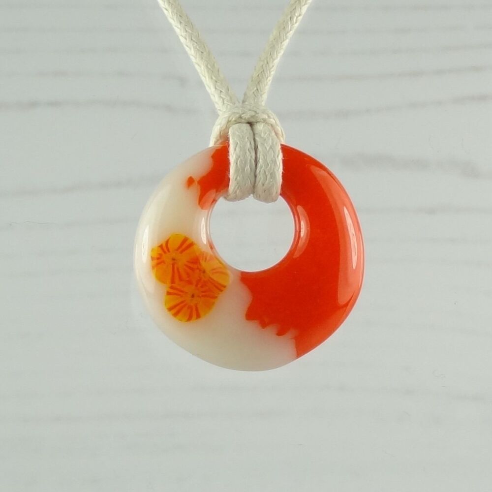 Handcrafted orange & light peach cream with murrini slices fused glass off-set round pendant on a waxed cotton cord with lobster clasp (#110)