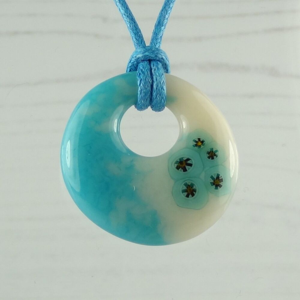 Handcrafted turquoise blue & light peach cream with murrini slices fused glass off-set round pendant on a waxed cotton cord with lobster clasp (#115)