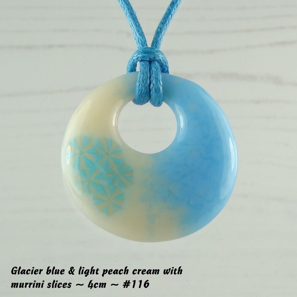 Handcrafted glacier blue & light peach cream with murrini slices fused glass off-set round pendant on a waxed cotton cord with lobster clasp (#116)