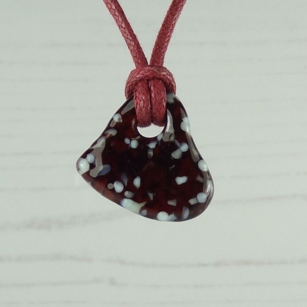 Handcrafted fused glass off-set heart shaped pendant on a waxed cotton cord