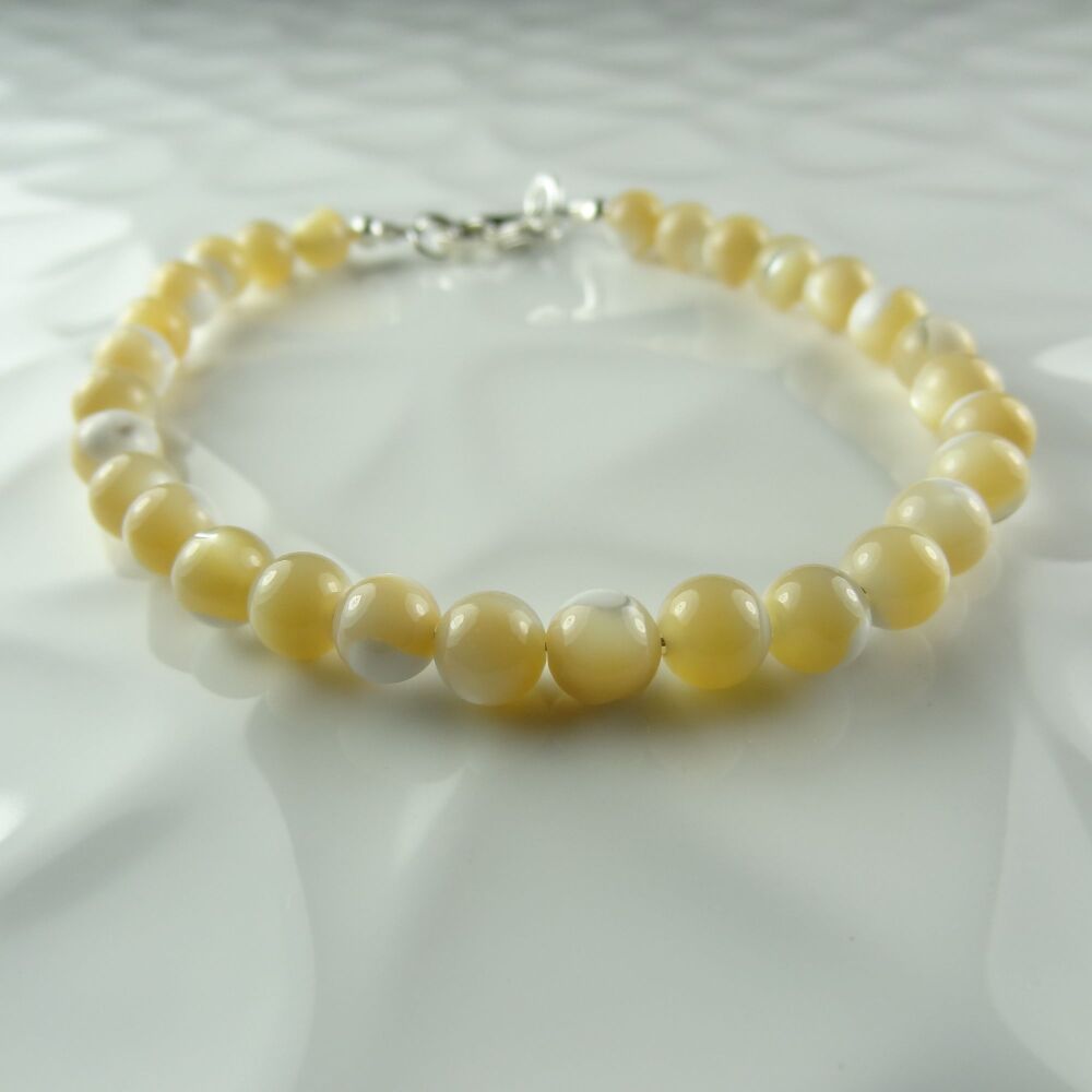 Sterling silver & 6mm (+/-) cream Mother-of-Pearl beaded bracelet with lobster clasp, in a gift box
