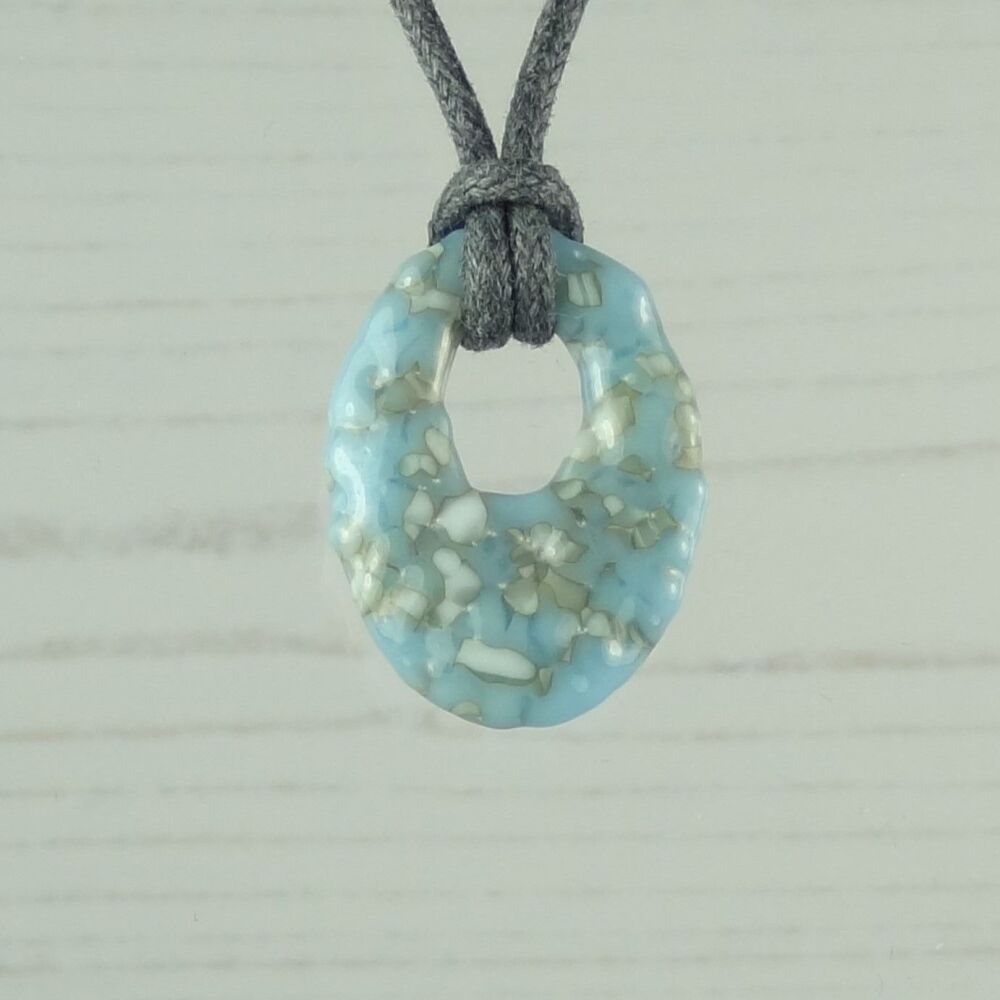 Handcrafted glacier blue & french vanilla fused glass off-set oval pendant on a waxed cotton cord with lobster clasp (#93)