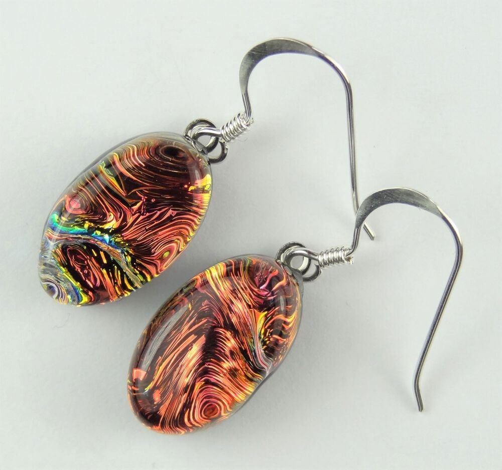 Handcrafted burnt orange genuine Dichroic glass oval earrings with sterling silver wires (#20273)