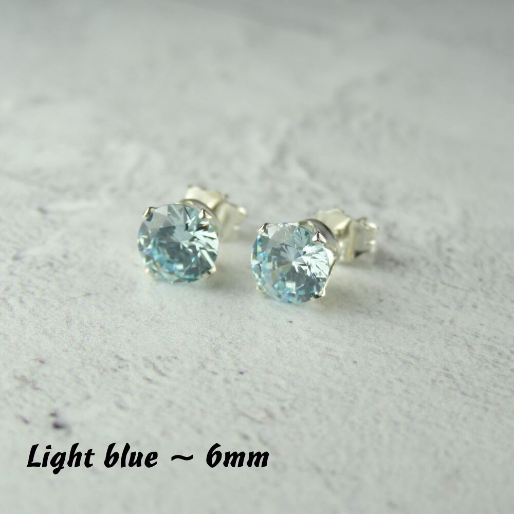 Sterling Silver 6mm faceted light blue Cubic Zirconia stud earrings in a gift box - Handcrafted with claw setting