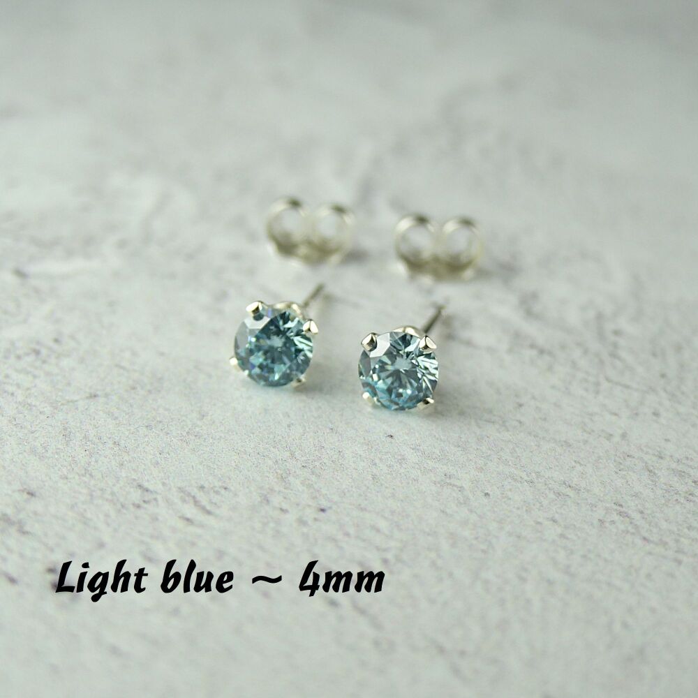 Sterling Silver 4mm faceted light blue Cubic Zirconia stud earrings in a gift box - Handcrafted with claw setting