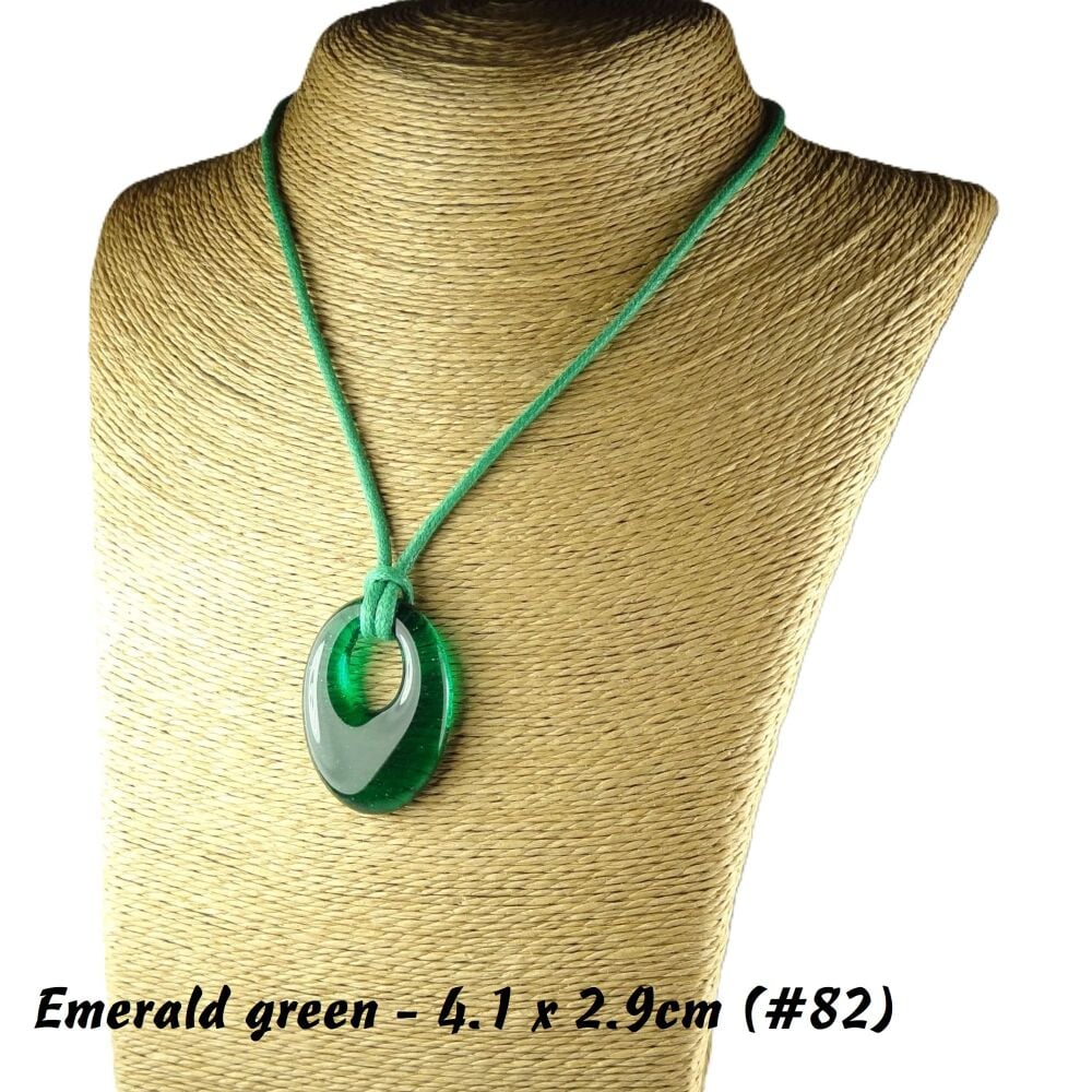 Handcrafted emerald green fused glass off-set oval pendant on a waxed cotton cord with lobster clasp (#82)