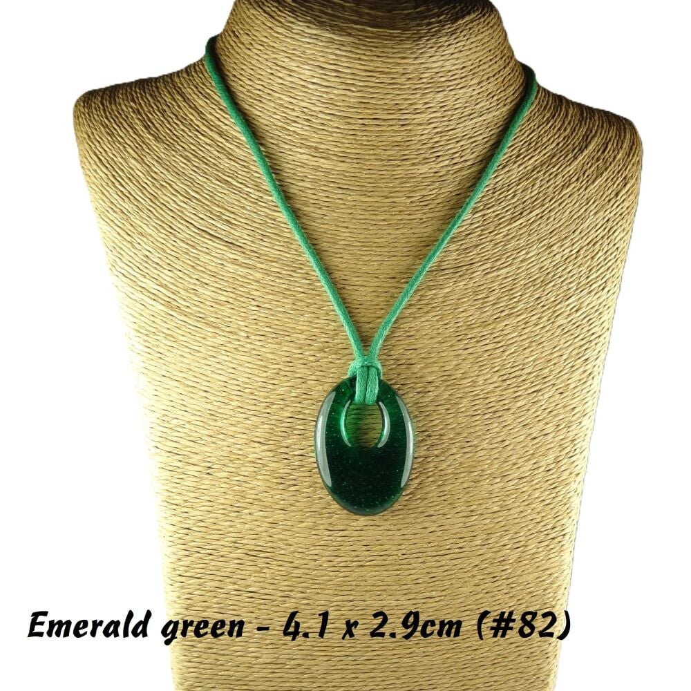 Handcrafted emerald green fused glass off-set oval pendant on a waxed cotton cord with lobster clasp (#82)