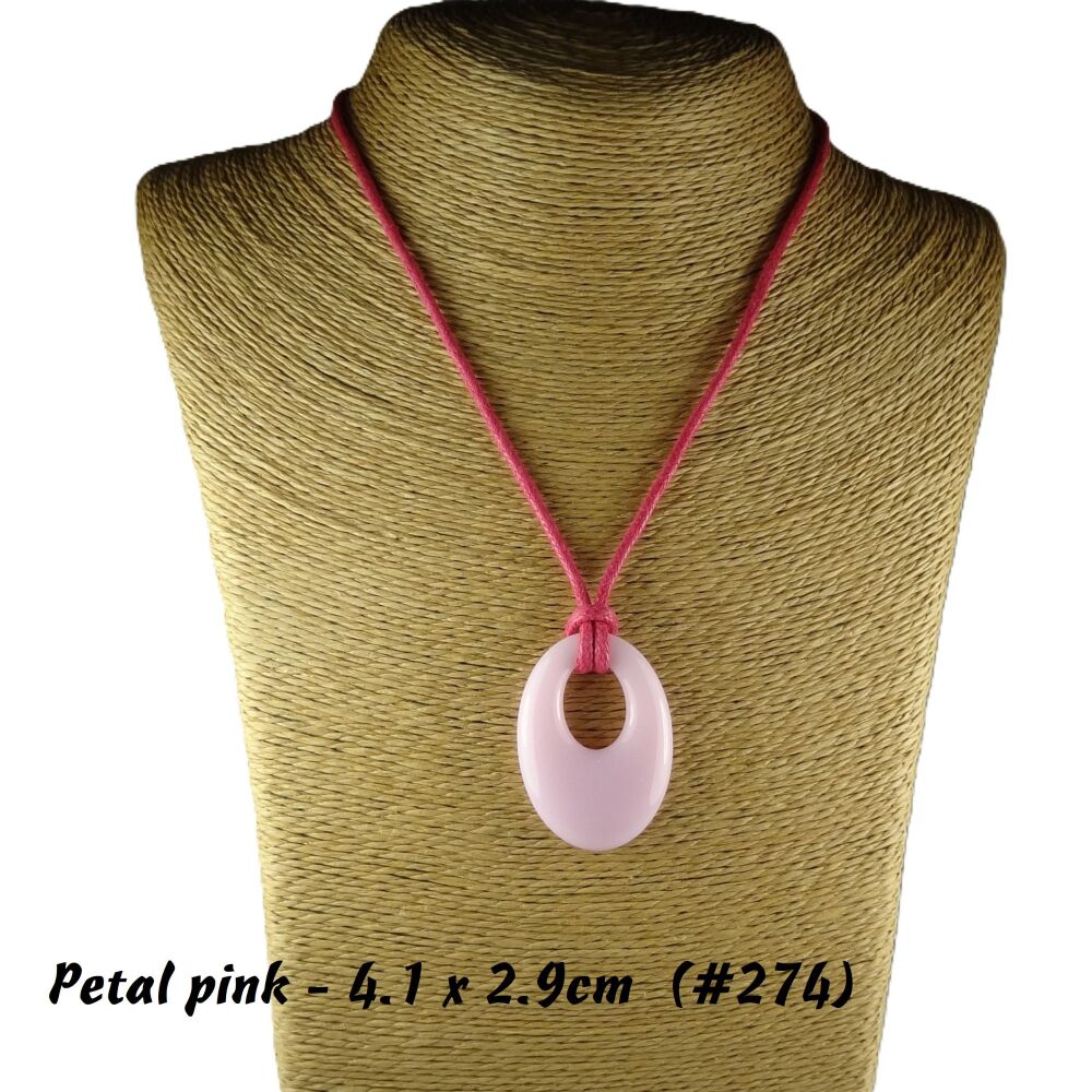 Handcrafted petal pink fused glass off-set oval pendant on a waxed cotton cord with lobster clasp (#274)