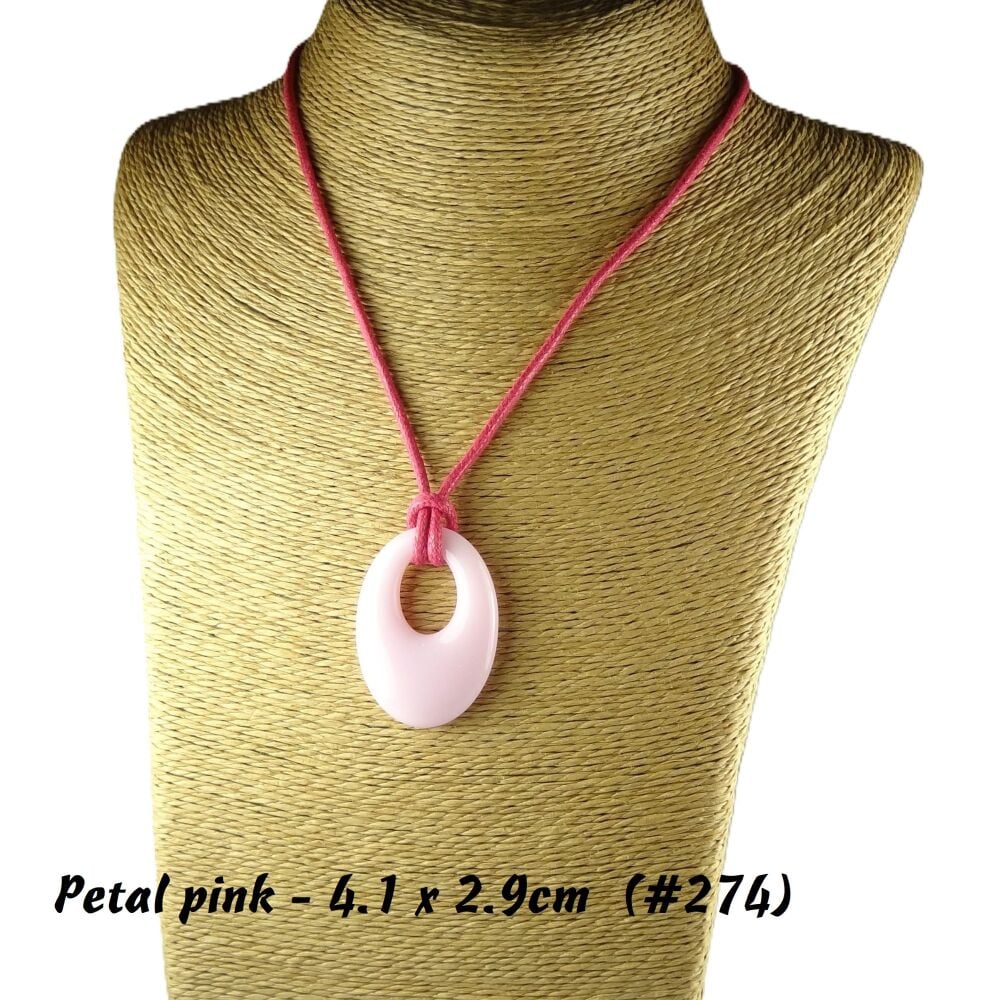 Handcrafted petal pink fused glass off-set oval pendant on a waxed cotton cord with lobster clasp (#274)